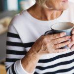 older woman drinking coffee