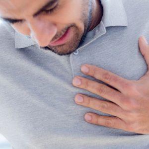 0 Man touching his chest in pain