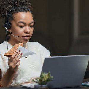 black woman snackin at work