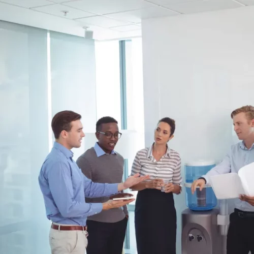 Read more about the article Office small talk can help leaders connect with employees, but there’s a downside