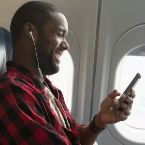 TAL man earbuds on phone airplane AIRPLANEMODE0623 ecbccbc4f6274becab6a824a1e1f8ce0