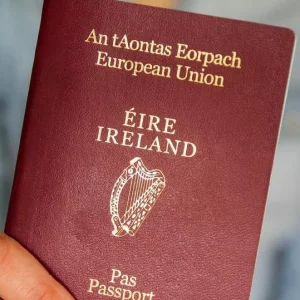 0 A man holding an Irish passport