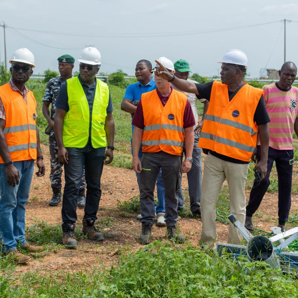 Bola Adebanjo explaining the mast coupling to the former commissioner