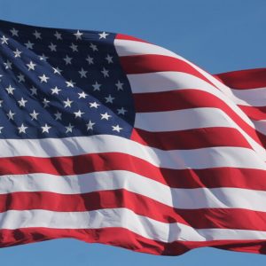 American Flag Waving on a Flag Pole 1140x570 1