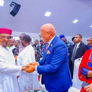 Senate President Godswill Akpabio in a warm handshake with Akwa Ibom State Governor Pastor Umo Eno
