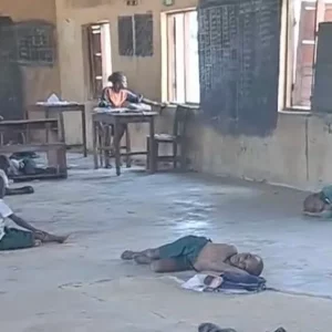 Pupils at Ibiaku Itam Primary school sitting on bare floor to learn e1771997905422
