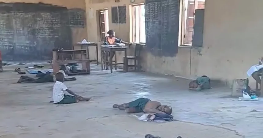 Pupils at Ibiaku Itam Primary school sitting on bare floor to learn e1771997905422